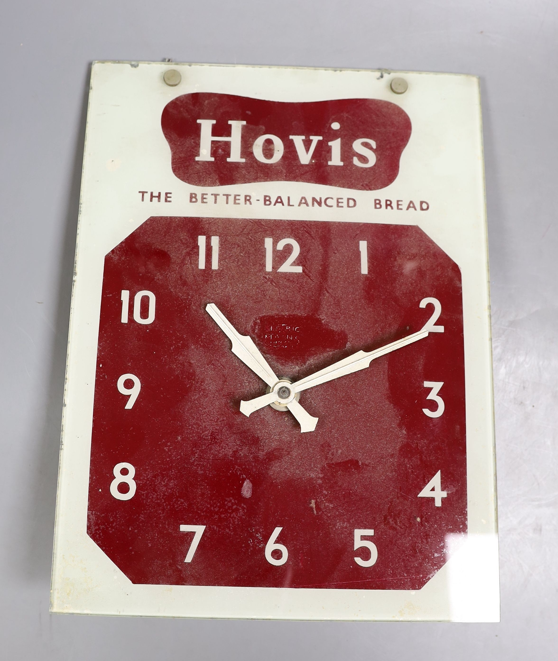 A Smiths electric advertising wall-clock, 'Hovis', glass dial 46cm high